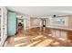 Bright and airy living room featuring hardwood floors, recessed lighting, and backyard access at 1721 Rachel Dr, Plainfield, IN 46168