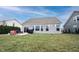 Home backyard with a patio area, green grass, and a view of adjacent properties at 19252 Chestnut Grove Ln, Noblesville, IN 46062