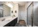 Stylish bathroom with double vanity, modern fixtures, and glass-enclosed shower offers comfort and convenience at 19252 Chestnut Grove Ln, Noblesville, IN 46062