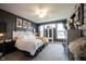 Comfortable bedroom with a decorative headboard, ample natural light, and modern decor at 19252 Chestnut Grove Ln, Noblesville, IN 46062