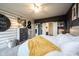 Cozy bedroom showcasing shiplap accent wall, unique decor, and a comfortable setting at 19252 Chestnut Grove Ln, Noblesville, IN 46062