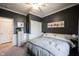 Comfortable bedroom with neutral tones, a ceiling fan, and closet space for relaxation at 19252 Chestnut Grove Ln, Noblesville, IN 46062