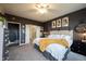 Relaxing bedroom featuring modern decor, a comfortable bed, and an en-suite bathroom entrance at 19252 Chestnut Grove Ln, Noblesville, IN 46062