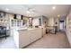 This bonus room showcases an island with storage, natural light, carpet, and stairs leading down at 19252 Chestnut Grove Ln, Noblesville, IN 46062