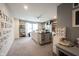 Spacious bonus room features painted walls, carpet, and a center island for flexible use at 19252 Chestnut Grove Ln, Noblesville, IN 46062