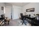 Well-lit home office featuring a modern desk, comfortable seating, and organized storage solutions at 19252 Chestnut Grove Ln, Noblesville, IN 46062