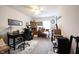 Inviting home office features an executive desk, a ceiling fan, and natural light at 19252 Chestnut Grove Ln, Noblesville, IN 46062