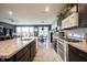 Modern kitchen featuring stainless steel appliances, stone countertops and a spacious island with sink at 19252 Chestnut Grove Ln, Noblesville, IN 46062