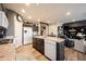 Spacious kitchen featuring an island with dishwasher, countertops, and dark cabinets at 19252 Chestnut Grove Ln, Noblesville, IN 46062