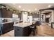 Stylish kitchen with dark cabinetry, a large island with seating, and an open layout at 19252 Chestnut Grove Ln, Noblesville, IN 46062