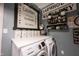 Farmhouse-style laundry room with modern appliances and rustic decorations, offering a charming space at 19252 Chestnut Grove Ln, Noblesville, IN 46062