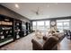 Comfortable living room featuring built in shelving, ceiling fan, and lots of natural light at 19252 Chestnut Grove Ln, Noblesville, IN 46062