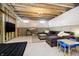 Unfinished basement featuring a seating area, television, and exposed ceiling, offering potential for customization at 19966 Chatham Green Dr, Westfield, IN 46074