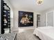 Bedroom features unique art and a modern lighted vanity mirror providing a chic and stylish aesthetic at 19966 Chatham Green Dr, Westfield, IN 46074