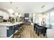 Open floor plan featuring a modern kitchen with island seating that flows into the living area at 19966 Chatham Green Dr, Westfield, IN 46074
