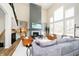 Spacious living room featuring a fireplace, high ceilings, and comfortable, modern furnishings at 19966 Chatham Green Dr, Westfield, IN 46074