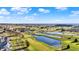 Scenic aerial view of a golf course community with ponds, trees, and well-manicured greens at 2199 Somerset Dr, Franklin, IN 46131