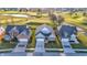 Aerial view of houses with manicured lawns and mature trees in a serene setting at 2199 Somerset Dr, Franklin, IN 46131