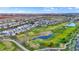 Vast aerial view featuring a scenic golf course, multiple ponds, and the surrounding neighborhoods at 2199 Somerset Dr, Franklin, IN 46131