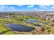 Expansive aerial view of the community featuring multiple ponds and a sprawling golf course at 2199 Somerset Dr, Franklin, IN 46131