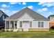 Back exterior features screened porch and views of the lawn at 2199 Somerset Dr, Franklin, IN 46131