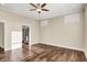 Spacious bedroom with hardwood floors, neutral walls, and natural light from multiple windows at 2199 Somerset Dr, Franklin, IN 46131