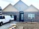 New construction home featuring modern brick facade, symmetrical rooflines, and a welcoming entrance at 2199 Somerset Dr, Franklin, IN 46131