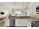 Stylish kitchen overlooking the living area, complete with stainless appliances and modern finishes at 2199 Somerset Dr, Franklin, IN 46131
