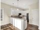 Modern kitchen with white cabinets, stainless steel appliances, and a breakfast bar for casual dining at 2199 Somerset Dr, Franklin, IN 46131