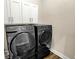 Modern laundry room equipped with front-loading Samsung washer and dryer at 2199 Somerset Dr, Franklin, IN 46131