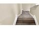 Carpeted stairway with white trim and handrail ascends to the next level in this home at 2199 Somerset Dr, Franklin, IN 46131