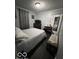 Comfortable bedroom featuring hardwood floors and a queen bed at 245 E Plum St, Anderson, IN 46012