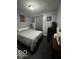 Cozy bedroom featuring modern decor, a comfortable bed, and ample natural light at 245 E Plum St, Anderson, IN 46012