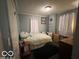 Cozy bedroom with natural light and comfortable furnishings at 245 E Plum St, Anderson, IN 46012