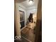 Functional entryway with tiled floor, coat rack, and stylish accents at 245 E Plum St, Anderson, IN 46012