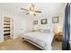 Inviting bedroom with ceiling fan, comfy queen bed, and bright natural lighting at 2709 Dawnlake Dr, Indianapolis, IN 46217