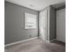 Bedroom featuring neutral walls, a window for natural light, and soft carpet flooring at 3022 Alice Ave, Indianapolis, IN 46237