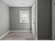 Bedroom with neutral-toned walls, a window for natural light, and soft carpet flooring at 3022 Alice Ave, Indianapolis, IN 46237