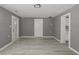 Open living room with neutral walls and modern flooring, featuring multiple doorways and ample space at 3022 Alice Ave, Indianapolis, IN 46237