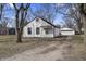 Charming home with white siding, nice yard, and detached garage, providing ample parking and curb appeal at 3104 Alice Ave, Indianapolis, IN 46237