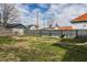 Backyard with grass and a sturdy gray wooden fence at 3732 N Kenwood Ave, Indianapolis, IN 46208