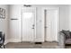Bright entryway featuring wood floors, white doors, and modern decor at 3732 N Kenwood Ave, Indianapolis, IN 46208