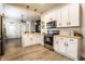 Bright open kitchen design with stainless steel appliances, and geometric backsplash at 3732 N Kenwood Ave, Indianapolis, IN 46208