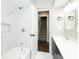 Updated bathroom with a tub, shower, and adjacent stairwell at 415 Ruskin Pl, Indianapolis, IN 46205