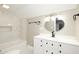 Bathroom featuring a vanity, updated tile, and a tub at 415 Ruskin Pl, Indianapolis, IN 46205