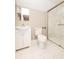 Bathroom featuring a vanity, toilet, and tiled shower with glass doors at 415 Ruskin Pl, Indianapolis, IN 46205