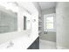 Modern bathroom featuring marble walls and double sinks at 415 Ruskin Pl, Indianapolis, IN 46205