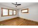 Cozy bedroom with hardwood floors, natural lighting, and a modern ceiling fan at 415 Ruskin Pl, Indianapolis, IN 46205