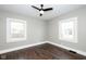 A bright bedroom with a ceiling fan and hardwood floors at 415 Ruskin Pl, Indianapolis, IN 46205