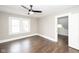 Bedroom with hardwood floors, a ceiling fan, and windows at 415 Ruskin Pl, Indianapolis, IN 46205